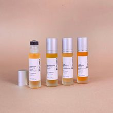 Load image into Gallery viewer, Part of Kavana's Epic Poetry Set of 4 Perfume Poems, Grapefruit Perfume Poem is accompanied by Peppermint, Plai and Rose Perfume Poems in an elegant white square box with black trim and grosgrain ribbon wrapped around it.