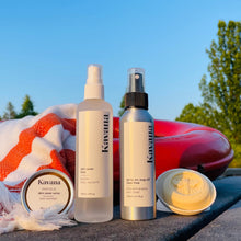 Load image into Gallery viewer, Kavana Summer quad, consists of the pictured products, from left to right: Skin Saver Salve, Skin Saver Mist, Bug OFF Mist, Eco-Deodorant bar. Pictured standing in front of a towel, draped over an orange, life saving buoy.