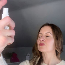 Load image into Gallery viewer, Woman applies Kavana's liquid moisturizing, non-toxic, flower powered, hormone safe Reviving Rose Glow Mist o her face, before applying her moisturizing face cream, Kavana's Phyto-5 Face Cream.