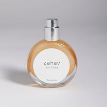 Load image into Gallery viewer, Kavana's Zahav, Eau fraiche, is a handmade, non-toxic light fragrance with a hint of golden shimmer.  Perfect for a summer hair spritz to add shine and delicious scent to the hair.  It's an updated nod to classic Eau de Cologne- a fresh and sophisticated citrus bouquet, blended with white flowers of neroli and orange blossom. An intoxicating and heady blend.