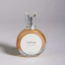 Load image into Gallery viewer, Kavana's Zahav, Eau fraiche, is a handmade, non-toxic light fragrance with a hint of golden shimmer.  Perfect for a summer hair spritz to add shine and delicious scent to the hair.  It's an updated nod to classic Eau de Cologne- a fresh and sophisticated citrus bouquet, blended with white flowers of neroli and orange blossom. An intoxicating and heady blend.