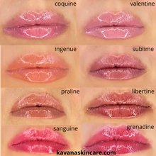 Load image into Gallery viewer, Kavana Tinted Lip Treatment oils, swatched on lips, to show the colours. The model is caucasian.