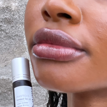 Load image into Gallery viewer, Model Raissa&#39;s lips in tight close up, seen wearing Kavaa&#39;s Phyto-5 Tinted Lip Treatment oil in shade LIbertine.
