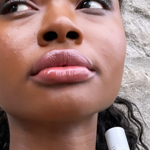 Load image into Gallery viewer, Model Raissa wears Seraphine, a sheer neutral Teracotta shade by Kavana on her lips, seen here in tight close up.
