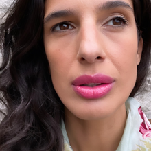 Load image into Gallery viewer, Kavana&#39;s Phyto-5 Tinted Lip Treatment oil in Eglantine, a bright fucshia, with blue undertones. The bottle sits atop a love note that says &#39;mon amour&#39; with a bright fuschia kiss mark on it!
