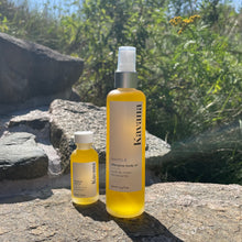 Load image into Gallery viewer, Kavana&#39;s bestselling Phyto-5 AFterglow Body oil in 30ml travel size mini glass bottle stands next to the large size 100ml bottle. BOth are refillable, reusable and recyclable after cleaning. The scent is very green and spa like and uplifting.
