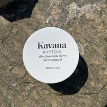 Load image into Gallery viewer, Kavana&#39;s bestselling Phyto-5 Afterglow Body Cream (200ml) is perfect to layer underneath the body oil. The scent is very green and spa like and uplifting. Shown here, the top of the jar, a wide white circle with label centered in the middle.
