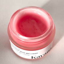 Load image into Gallery viewer, Rose Moon Glow Gel Cream is a lightweight primer and moisturizer, 2-in-1. Pictured here, the open jar with a brushed, matte silver coloured cap, perched on the lip of the jar. Another jar flipped on it&#39;s side, cane be seen, the pink colour of the gel showing through it. This gel goes on clear on the skin, leaving now colour behind. 
