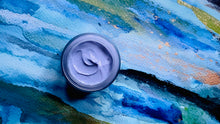 Load image into Gallery viewer, Open jar of Kavana&#39;s Phyto-5 Blue Moon Rich Night Cream. The cream is blue and on a painted blue aquarelle background with specks of gold, black, orange and green on a watercolour blue that looks like water. 
