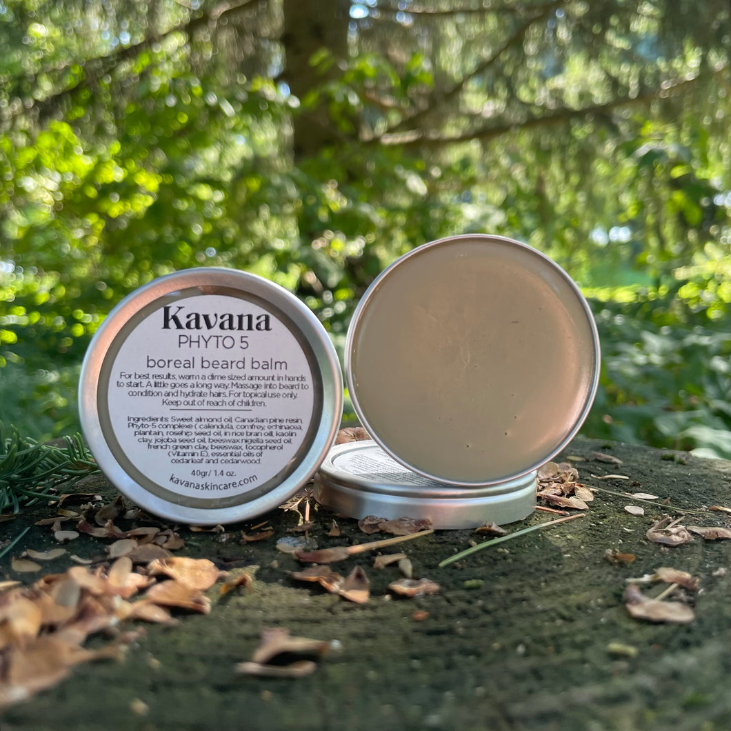 Kavana's Phyto-5 Boreal Beard balm, comes in a small,reusable and recyclable aluminum tin. Seen here on the forest floor, amongst the trees. 