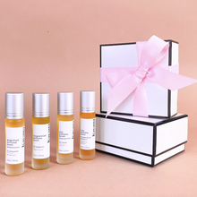 Load image into Gallery viewer, PMS Perfume Quattro: 4 botanical, aromatherapy fragrance oil blends in convenient roll-ons. 100% non-toxic and hormone safe, clean perfume. Handmade with certified pure, therapeutic grade essential oils.
