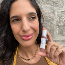 Load image into Gallery viewer, Model Kristel wears Kavana&#39;s Phyto-5 Tinted LIp oil in Praline- a nude browny rose.
