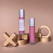 Load image into Gallery viewer, Kavana&#39;s Phyto-5 Tinted lip Treatment oil in the shade &#39;Coquine&#39;, is a sheer, flirty, Parisian Pink, with cool blue undertones. An everyday, passe partout, it goes with everything on everyone! The love note underneath reads &#39;bises bises&#39; overtop of a lip print in the colour Coquine
