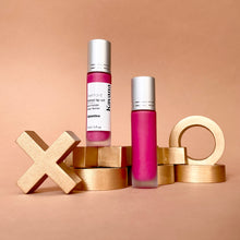 Load image into Gallery viewer, Kavana&#39;s Phyto-5 Tinted Lip Treatment oil in Eglantine, a bright fucshia, with blue undertones. The bottle sits atop a love note that says &#39;mon amour&#39; with a bright fuschia kiss mark on it!

