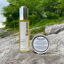 Load image into Gallery viewer, Condition and soften beard hairs with Kavana&#39;s Phyto-5 Conditioning Beard oil and Boreal Beard Balm.  Inspired by the largest intact forest on earth- Canada&#39;s Boreal forest, these products are infused with Cedarwood and Cedarleaf essential oils and plant oils like Nigella, Hemp and jojoba to soften and keep beards intact and looking and feeling great. Pictured here, the bottle of beard oil standing on a rock, next to the tin of Beard Balm. Greenery in the background .
