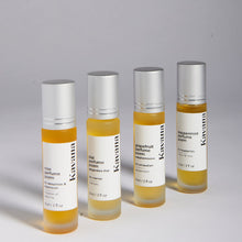 Load image into Gallery viewer, Kavana Perfume Poems are therapeutic fragrances, conceived for different symptoms of PMS. Left-right: Neroli, rose, grapefruit, peppermint and plai (Thai Ginger) blends, 9ml each, roll-on in a frosted glass bottle.  
