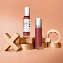 Load image into Gallery viewer, Kavana&#39;s Phyto-5 Tinted Lip Treatment oil in shade Seraphine, a warm, golden terracotta brown, a dramatic and bold choice but still neutral. Gorgeous on the cheeks too! Seraphine is seen here, atop a love note that says &#39;mon ange&#39;, my angel.

